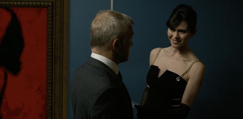Christoph Waltz and Anna MacDonald in The Consultant (2023)