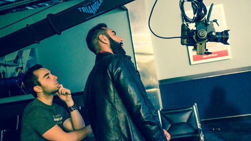 Director Aziz Tazi and La Fouine study a crane shot on French rapper's music video