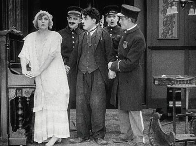 Charles Chaplin, George Cleethorpe, Fred Goodwins, Edna Purviance, and Leo White in Police (1916)