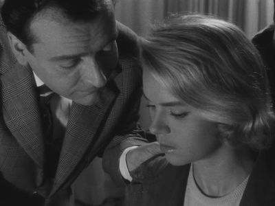Claude Cerval and Geneviève Cluny in The Cousins (1959)