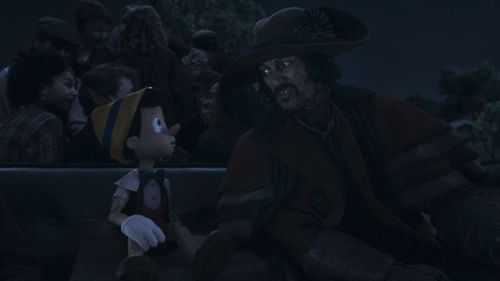 Luke Evans and Benjamin Evan Ainsworth in Pinocchio (2022)