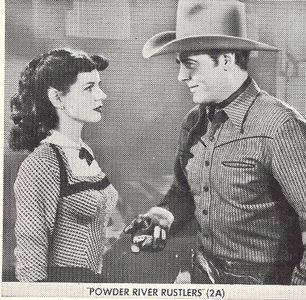 Gerry Ganzer and Allan Lane in Powder River Rustlers (1949)