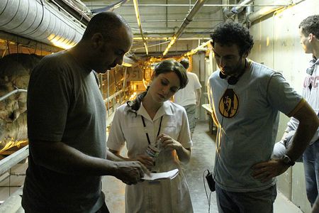 Director DARIN SCOTT and Writer/Producer STEVE KRIOZERE (r.) confer with CHRISTINE DONLON who plays Nurse Violet MacRead