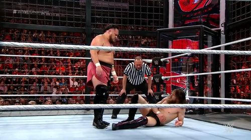 Jeff Hardy, Bryan Danielson, and Joe Seanoa in WWE Elimination Chamber (2019)