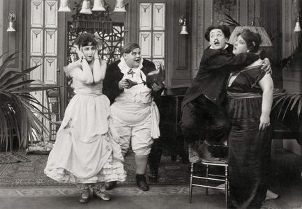 Bebe Daniels, Dee Lampton, Harold Lloyd, and May White in Luke's Society Mixup (1916)