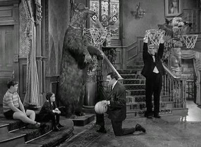 John Astin, Ted Cassidy, Lisa Loring, and Ken Weatherwax in The Addams Family (1964)