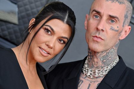 Travis Barker and Kourtney Kardashian at an event for The 64th Annual Grammy Awards (2022)