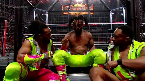 Kofi Kingston, Austin Watson, and Ettore Ewen in WWE Elimination Chamber (2019)