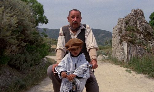 Salvatore Cascio and Philippe Noiret in Cinema Paradiso (1988)
