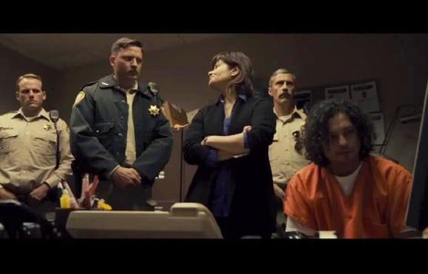 Michelle Rios (Flora) and Aden Young (Sheriff Randall) in a scene from 