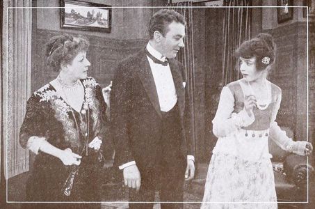 Marguerite Courtot, Tom Moore, and Isabelle Evesson in The Girl and the Bachelor (1915)
