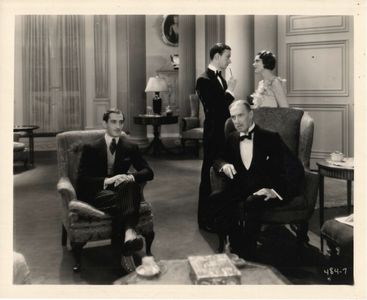 Basil Rathbone, Herbert Bunston, Moon Carroll, and Mackenzie Ward in The Lady of Scandal (1930)