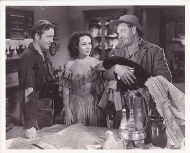 Wallace Beery, Dolores del Rio, and John Howard in The Man from Dakota (1940)