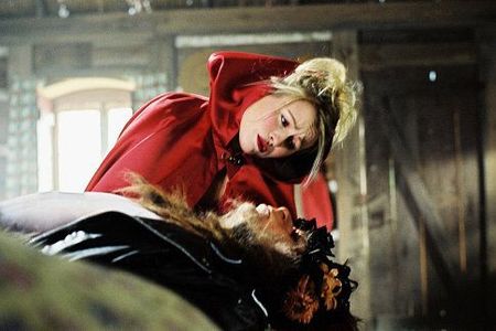 Mitsou Gelinas as Little Red Riding Hood and Marc Labrèche as The Big Bad Wolf in the Denise Filiatrault film ALICE'S OD