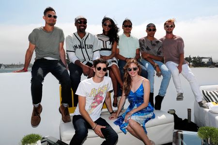 Tom Cavanagh, Tom Felton, Danielle Panabaker, Grant Gustin, Candice Patton, Keiynan Lonsdale, and Carlos Valdes at an ev