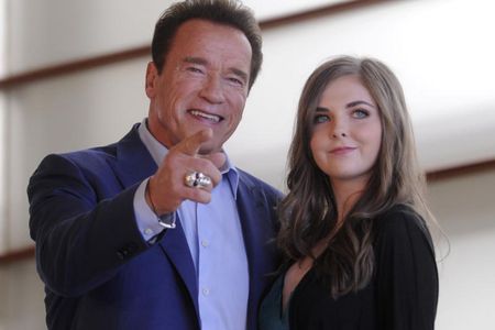 Actor Arnold Schwarzenegger and singer Maisy Kay attend the 'Wonder Of The Sea 3D' photocal