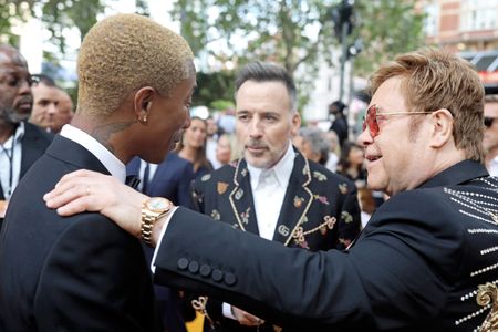 Elton John, David Furnish, and Pharrell Williams at an event for The Lion King (2019)