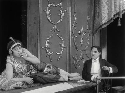 Charles Chaplin and May White in A Night in the Show (1915)