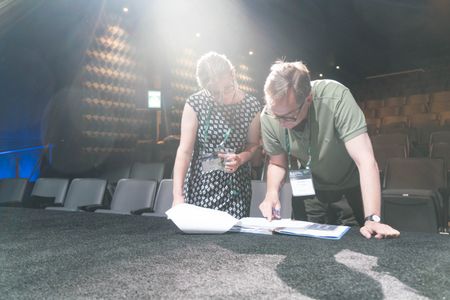 Producer Richard Berge with Associate Producer Robyn Kopp preparing to shoot the climate change slideshow with Al Gore a
