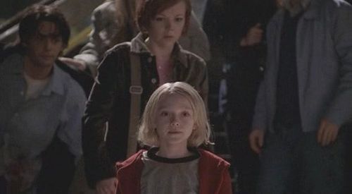 Emily Bergl, Dakota Fanning, and Adam Kaufman in Taken (2002)