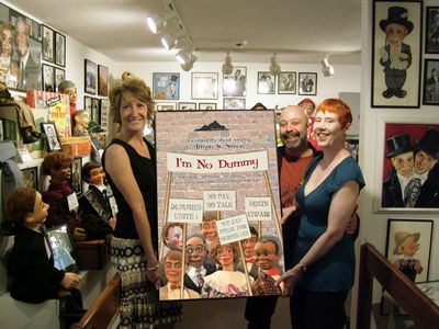 Director Bryan W. Simon presents a special poster for the documentary I'M NO DUMMY to Lisa Sweasy Curator of the Vent Ha