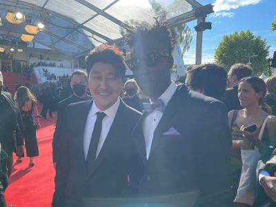 Kang-ho Song and Jean Jean on the steps of the Palais de Cinéma de Cannes 2021