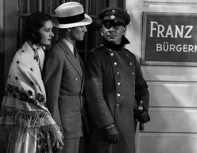 Erich von Stroheim, Wera Engels, and Leslie Fenton in Fugitive Road (1934)