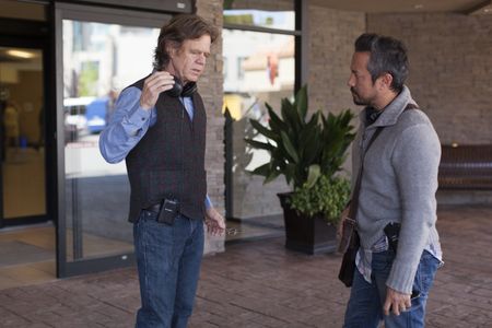 Director, William H Macy, and writer, Lance Krall, discuss a scene on the set of 