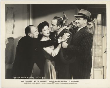 Joan Crawford, Melvyn Douglas, and Roland Young in They All Kissed the Bride (1942)