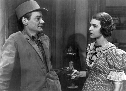 Russell Hopton and Charlotte Wynters in Renegade Trail (1939)