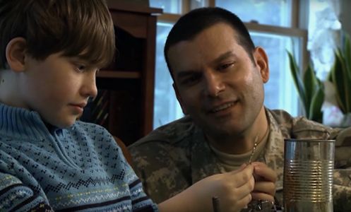 Sergeant Gold shares a special moment with his son before departing for Iraq.