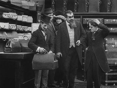 Charles Chaplin, Eric Campbell, Charlotte Mineau, Leo White, and Tom Nelson in The Floorwalker (1916)