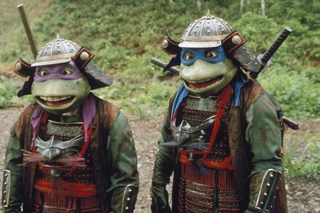 Corey Feldman, Mark Caso, Jim Raposa, and Brian Tochi in Teenage Mutant Ninja Turtles III (1993)