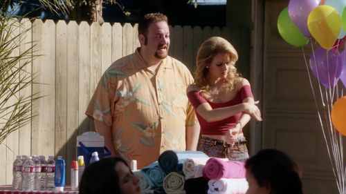 Amanda's husband (Ben Zelevansky) offers to assist Honey (Chelsey Crisp) with her sunscreen application on 