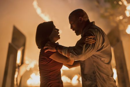 Neve Campbell and Dwayne Johnson in Skyscraper (2018)