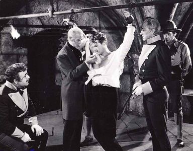 Douglas Fairbanks Jr., John Emery, Frank Hagney, Akim Tamiroff, and H.B. Warner in The Corsican Brothers (1941)