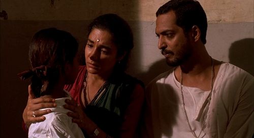 Nana Patekar, Anita Kanwar, and Hansa Vithal in Salaam Bombay! (1988)