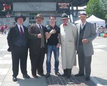 Photo of Matthew W. Allen (Left) and the rest of the Founding Four at Indianapolis Motor Speedway with a Young Simon Pag