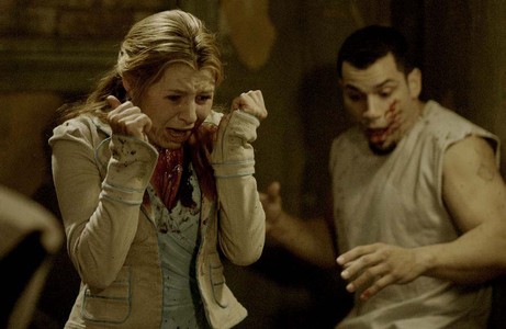Beverley Mitchell and Franky G in Saw II (2005)
