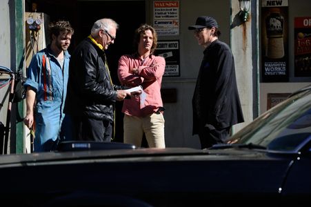 FROM L TO R: Christopher Sommers, Brian Trenchard Smith, Thomas Jane and John Cusack talk through a scene from Drive Har