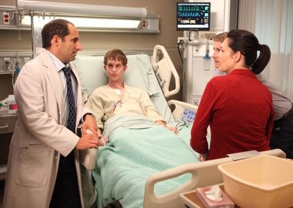 Peter Jacobson, Elizabeth Lackey, Kovar McClure, and Harrison Thomas in House (2004)