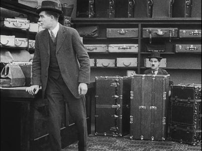 Charles Chaplin and Tom Nelson in The Floorwalker (1916)