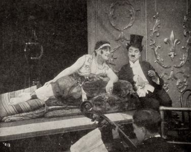 Charles Chaplin and May White in A Night in the Show (1915)