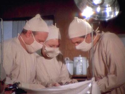 Alan Alda, Larry Linville, and Sheila Lauritsen in M*A*S*H (1972)