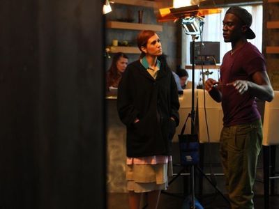 Shadae Lamar Smith, director of Miss Famous, is seen here working behind the scenes with actress Kristen Wiig who play