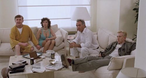Tim Roth, Terence Stamp, Bill Hunter, and Laura del Sol in The Hit (1984)