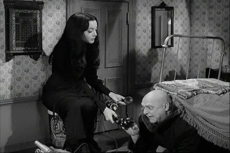 Jackie Coogan and Carolyn Jones in The Addams Family: Cousin Itt's Problem (1965)