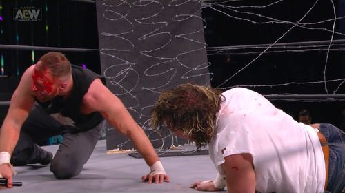 Kenny Omega and Jonathan Good in All Elite Wrestling: Revolution (2021)