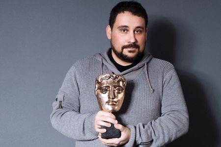 Victor Perez holding the BAFTA Statuette for Harry Potter And The Deathly Hallows