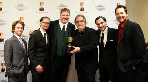 Presenter Seth Green congratulates the winners for best home entertainment production: David X. Cohen, John DiMaggio, Ma
